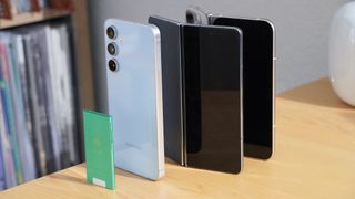 A lineup of phones and a thin iPod nano.